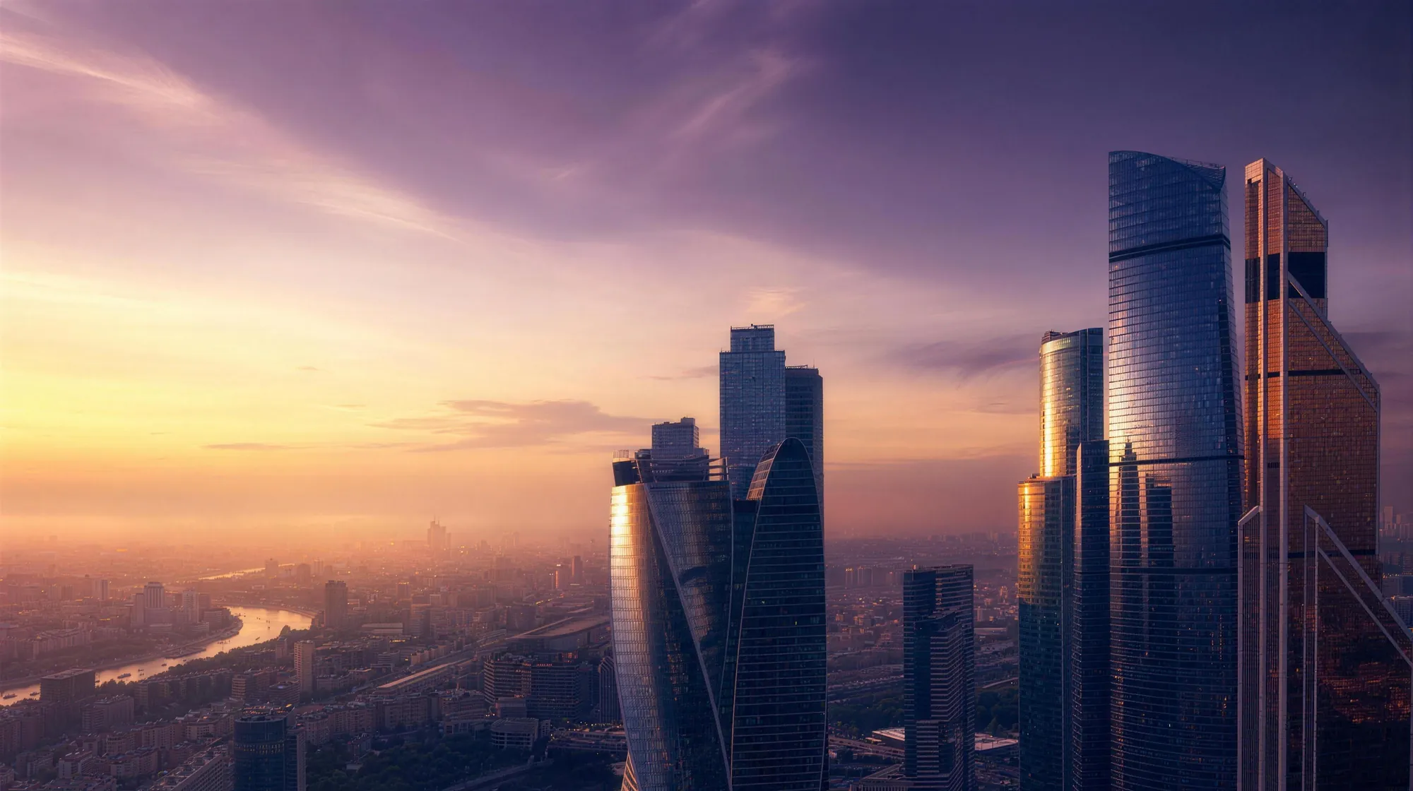 Gleaming modern glass towers of a financial district at golden hour under a soft violet sky.
